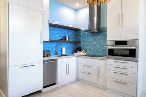 Stovetop, dishwasher, coffee/tea maker, dining tables