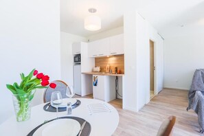 Comfort Apartment, Balcony | Living area | 80-cm TV with digital channels