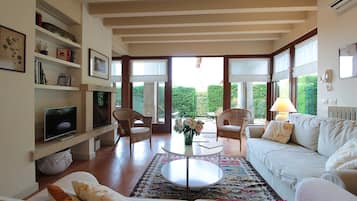 Apartment, Patio, Garden View | Living area | 32-inch flat-screen TV with digital channels