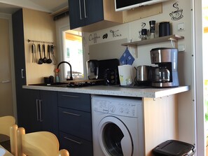 Fridge, microwave, stovetop, coffee/tea maker