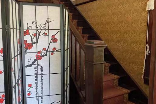 Stairs immediately upon entering to upper floor unit.