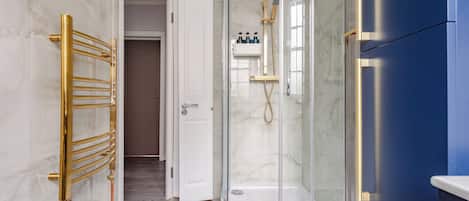 Shower, hair dryer, towels, soap