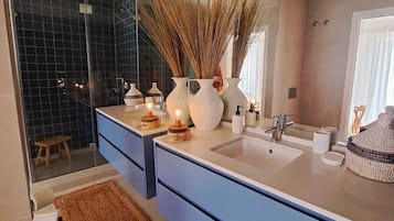 Shower, hair dryer, towels, soap