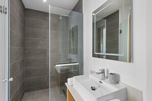Shower, towels, soap, toilet paper