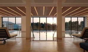 Indoor pool, outdoor pool, pool umbrellas, sun loungers - Falkensteiner Resort Lake Garda (Salò)