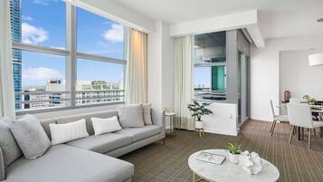 Condo, Balcony, City View | Living area | 10-inch plasma TV with cable channels