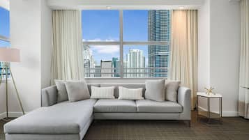 Condo, Balcony, City View | Living area | 10-inch plasma TV with cable channels