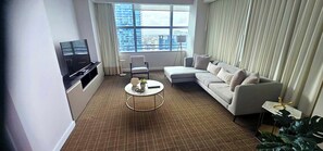 Condo, Balcony, City View | Living area | 10-inch plasma TV with cable channels