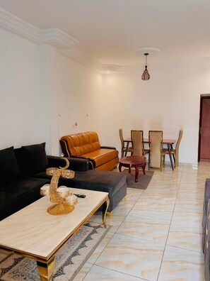 Deluxe Penthouse, Balcony, City View | Living area | Computer monitors