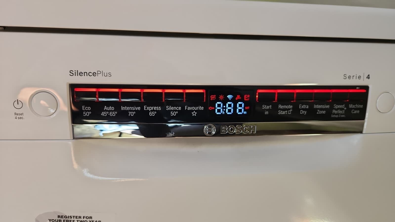 A Bosch SilencePlus washing machine with a digital display.