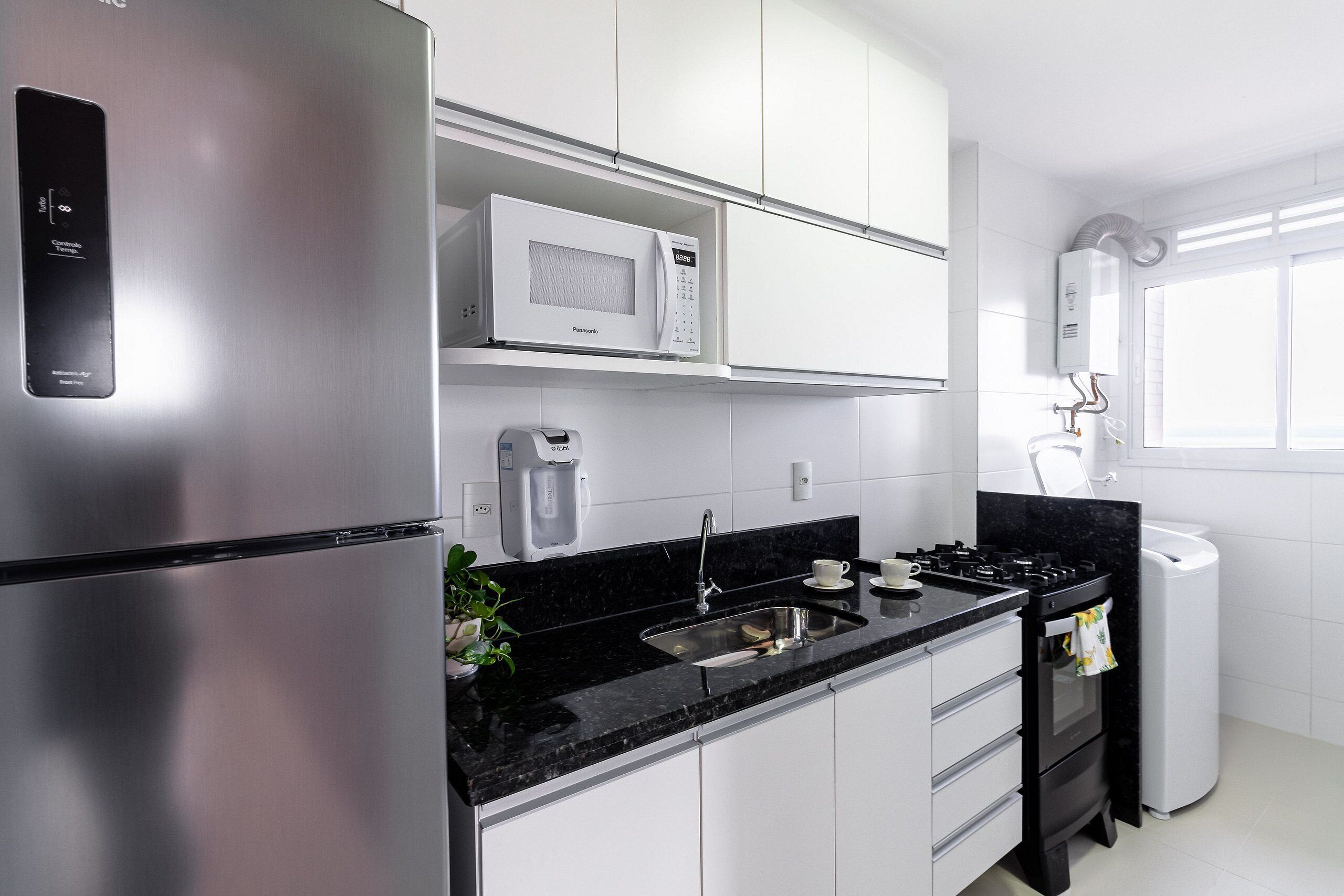 Fridge, microwave, coffee/tea maker, cookware/dishes/utensils
