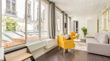 Apartment, Courtyard View | Living area | 32-inch Smart TV with cable channels, Netflix, streaming services