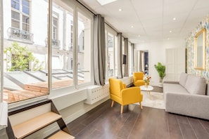 Apartment, Courtyard View | Living area | 32-inch Smart TV with cable channels, Netflix, streaming services