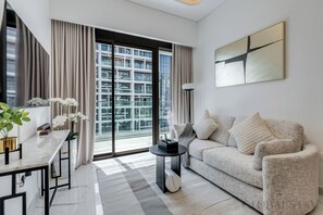 Luxury Apartment, 2 Bedrooms, Air conditioning, City View | Living area | 43-inch flat-screen TV with cable channels, Netflix, streaming services