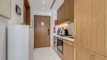 Luxury Studio, 1 Queen Bed, Balcony, City View | Private kitchen | Full-sized fridge, microwave, oven, stovetop