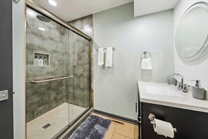 Shower, hair dryer, towels, shampoo