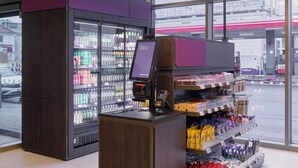 A modern retail space with a refrigerated display, a self-service beverage dispenser, and a variety of packaged goods. - Premier Inn Stuttgart Zuffenhausen (Stuttgart)