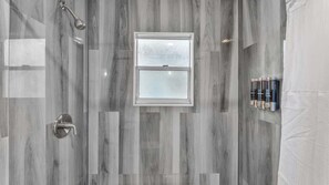 Shower, hair dryer, towels, shampoo