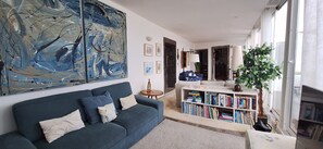 TV, fireplace - Azorean Stone House - Renovated with Contemporary Design (Lagoa)