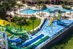 A water park with multiple slides and a large pool area. - Windsor Hills Luxe 4BR Villa w/ Pool & Game Room (Kissimmee)