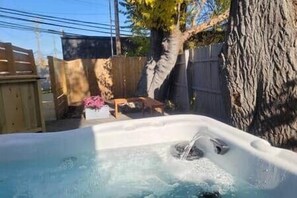 Outdoor spa tub - *Oceana* Entire King 3 BR lower level
at MicroLux (Royal Oak)