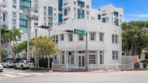 A white building with a sign reading "Harding Ave" and "Hotel" on the front. - #11 Corner Unit in Mid-century Art-Déco building KingBed EnSuiteBath PetsOK (Miami Beach)