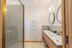 Shower, hair dryer, towels, soap