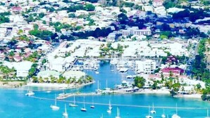 A coastal town with numerous boats anchored in the marina. - Villa AMAYA for 4 people (Saint-François)