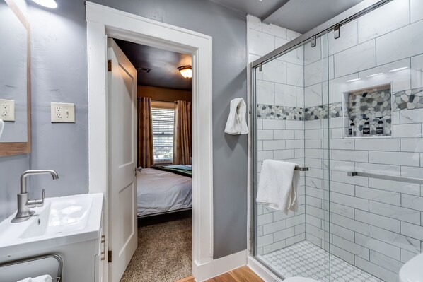 Shower, hair dryer, towels, soap