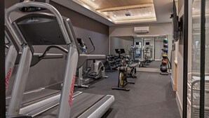 A gym with treadmills, weight machines, and exercise balls. - Sosuite 1bed Apt w Roof Deck, Gym, Laundry (Philadelphia)