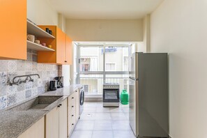 Apartment, 2 Bedrooms, Balcony, City View | Private kitchen | Full-sized fridge, microwave, oven, stovetop - Slate - 2Br Apt W Balcony in Mar Mikhael (Beirut)
