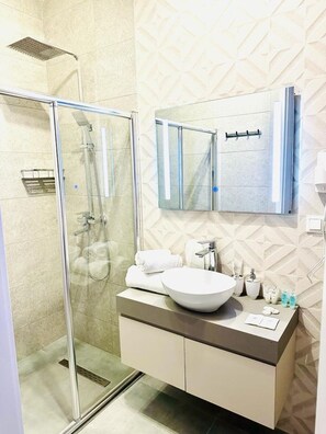 Shower, hair dryer, towels, soap