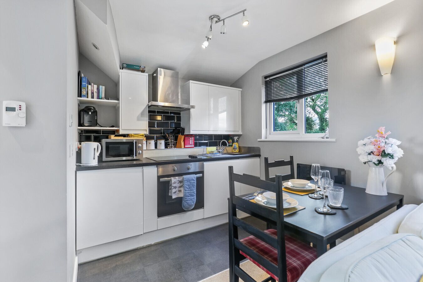 Fridge, microwave, toaster, dining tables