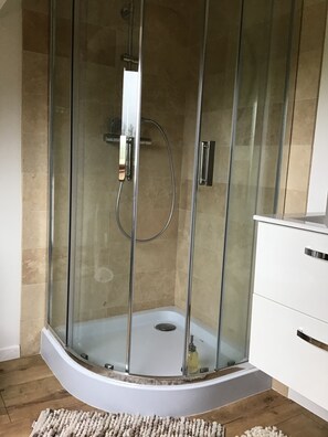 Shower, hair dryer, towels, soap
