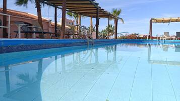 Outdoor pool, pool umbrellas, pool loungers
