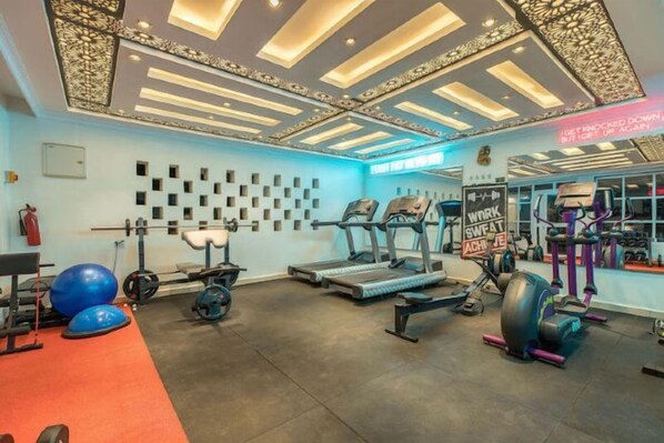 A gym with treadmills, weights, and exercise balls. - Gigiri Lion Villas II (Nairobi)