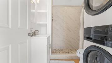 Shower, hair dryer, towels, soap