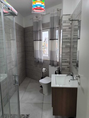 Shower, towels, soap, toilet paper