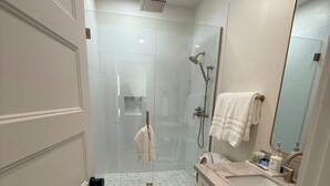 A modern bathroom with a shower, toilet, and vanity. - Newly Remodeled Chandler Gem — Stylish 3 Bed, 2 Bath Home Awaits! (Chandler)