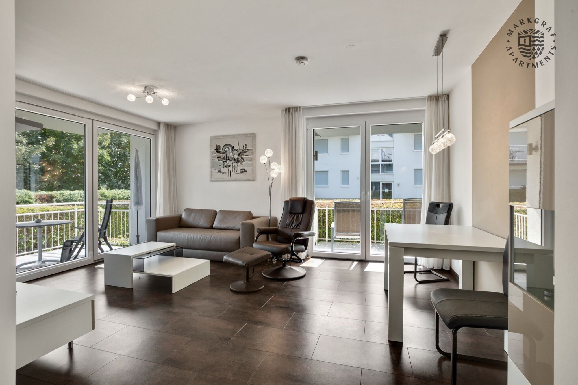 Deluxe Apartment | Living area | 90-cm flat-screen TV with cable channels