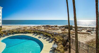 Bright and spacious condo with beach & ocean views, pool, basketball & balcony