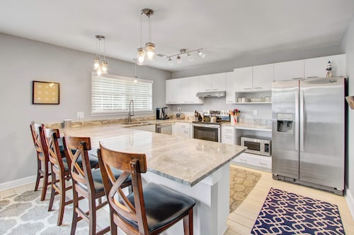 Convenient dog-friendly retreat steps from the beach with grill & screened porch
