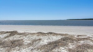 A beach with clear skies and calm water. - Condo with sunset views, with ocean/inlet views - walk to the Beach Club (Seabrook Island)