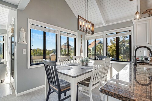 Stylish beach villa with three decks, and golf course views