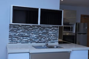 Apartment, Balcony, City View | Private kitchen | Mini-fridge