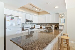 Fridge, microwave, oven, stovetop - Oceanfront villa steps from the beach w/private balcony & shared pool (Folly Beach)