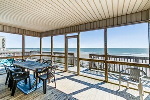 Outdoor dining - Oceanfront home with private beach access, screened porch & large deck (Folly Beach)