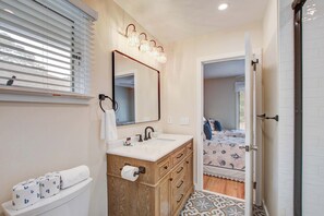 Shower, hair dryer, towels, shampoo