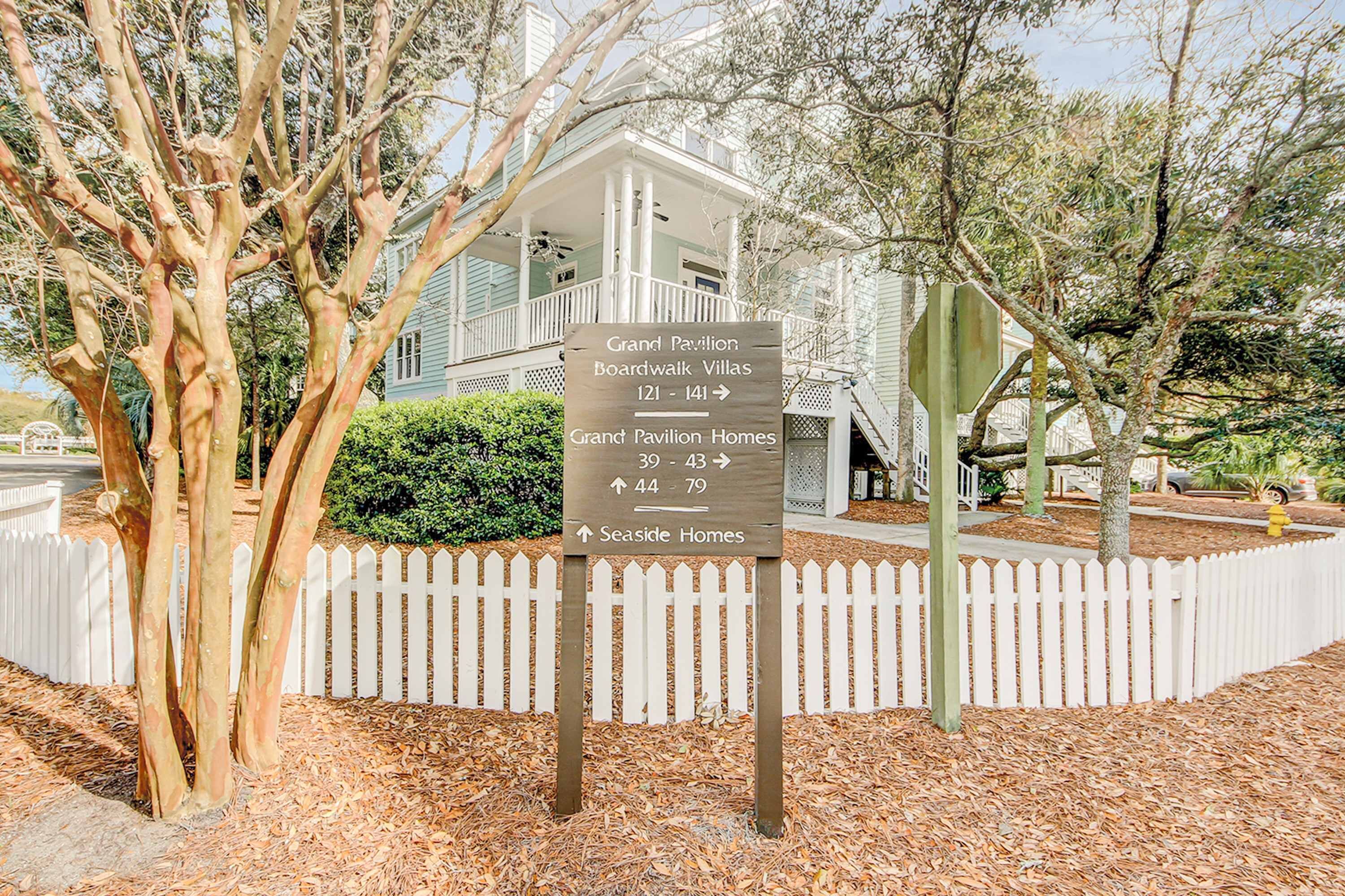 A sign with directions to Grand Pavilion Boardwalk Villas, Grand Pavilion Homes, and Seaside Homes.