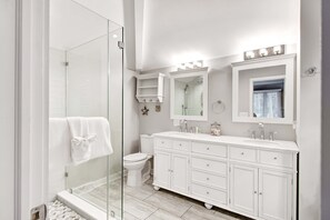 Shower, hair dryer, towels, shampoo
